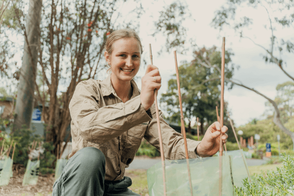 Photograph of Jess, Biodiversity Officer, working in bushland