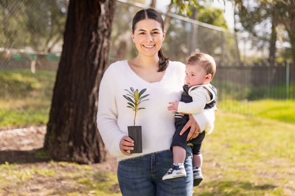 Daniella Cavallo and baby Elijah receive a tree from Council at Wattleview Maternal and Child Health Centre in Ferntree Gully