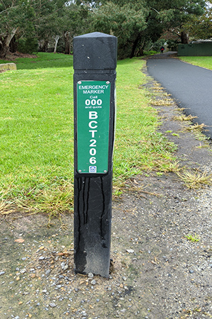 photo of an emergency marker - a sign on a post with a number showing where they are