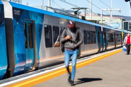 A Metro train at a Melbourne train station.