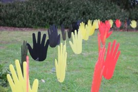 Black, yellow and red hand cut-outs to signify the colours of the Aboriginal flag.