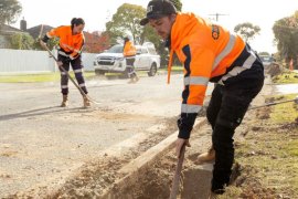 A road crew performing drainage works in a suburban street in Knox.