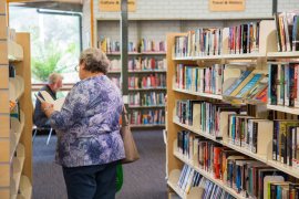 Woman browsing books in library