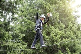 Young person on a high ropes course 
