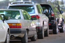 cars parked on a local street 