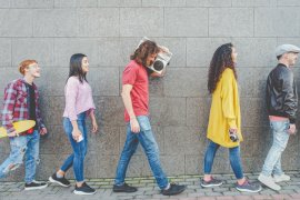 Friends walking together in the city centre.