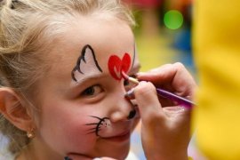 Child having face painted