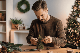 Young man doing Christmas crafts