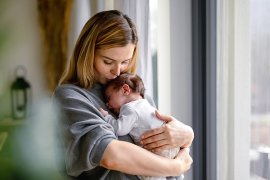young mum holding her baby