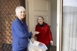 Volunteer delivering meals on wheels to a Knox resident 