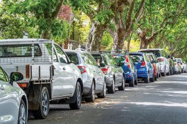 Cars parked on a street.