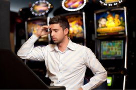 person in front of electronic gaming machines 