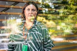 Natasha Quarm looking out of a window.