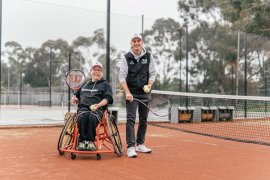 Two people playing tennis