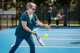 Person playing pickleball 