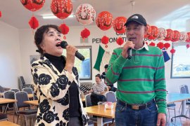 Two people doing karaoke 