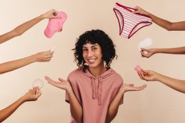 Young female surrounded by reuseable period and continence product options
