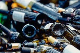 Image of a pile of glass wine bottles