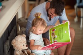 Parent and child reading a story