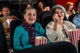 Two senior women at the movie theatre