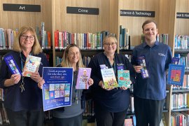 Your Library staff members holding curated books for Ageism Awareness Day