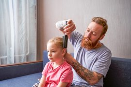 Dad doing a child's hair
