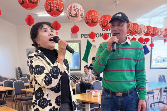 Two people doing karaoke 