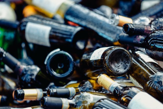 Image of a pile of glass wine bottles