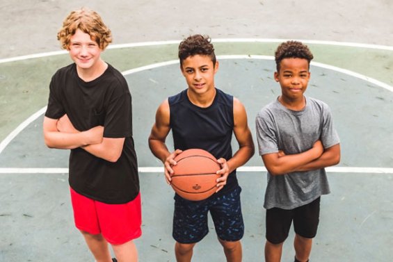 3 young people on a basketball court