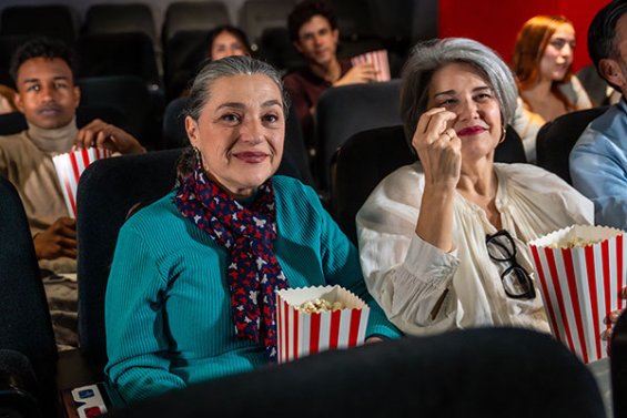 Two senior women at the movie theatre