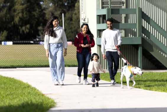 family walking dog