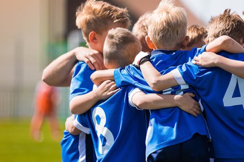 Children sports team huddle