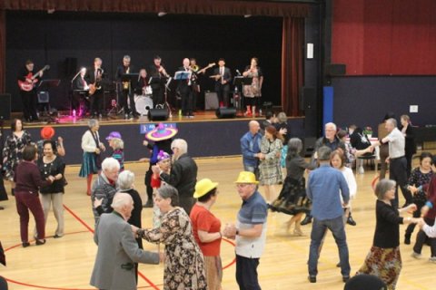 large group of people dancing 