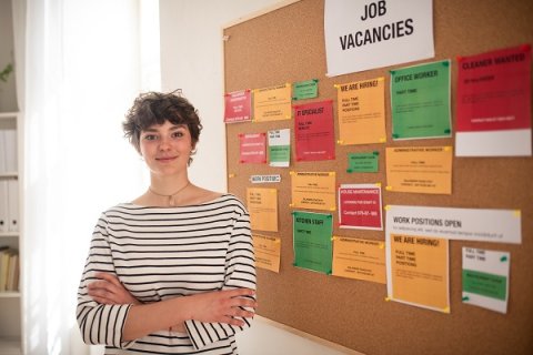 Young person with a jobs board