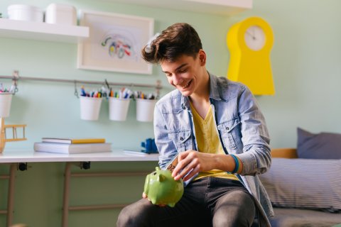 Young person with money box