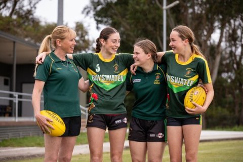Girls playing football
