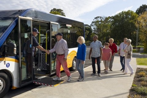 People getting onto a bus