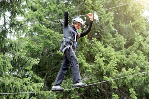 Young person doing a high ropes course