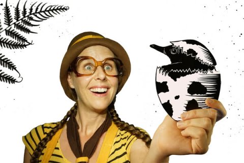 Person in explorer outfit holding an illustrated echidna egg