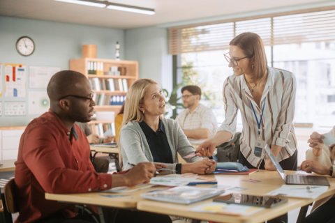 People around a table talking