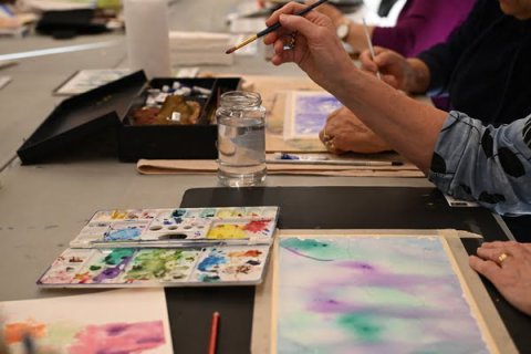 People painting using water colours