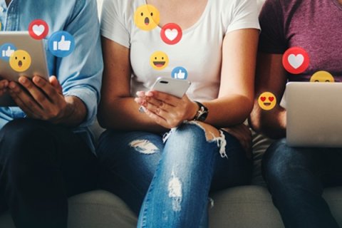 Person using a tablet, person using a mobile phone and person using a laptop